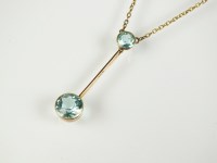 Lot 225 - A blue paste pendant, designed as two...