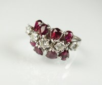 Lot 236 - A diamond and ruby dress ring, designed as a...