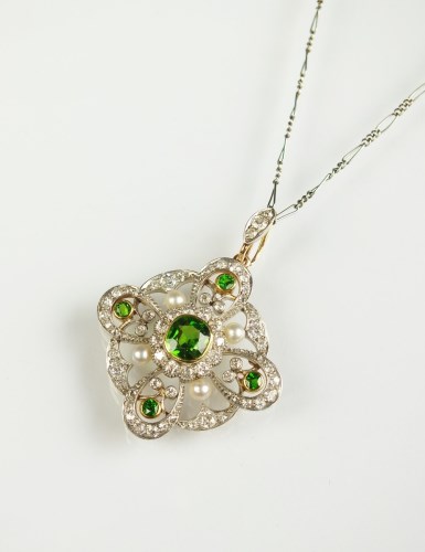 Lot 240 - A demantoid garnet, diamond and seed pearl...