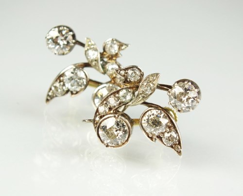 Lot 248 - A pair of diamond earrings, each designed as a...