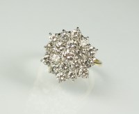 Lot 255 - An 18ct gold diamond hexagonal cluster ring,...