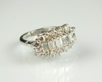 Lot 256 - A diamond dress ring, designed as a central...