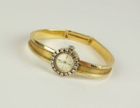 Lot 273 - A lady's 18ct yellow and white gold diamond...