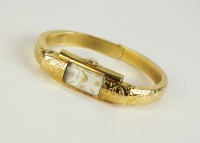 Lot 275 - A Lady's 18ct gold Pallas bangle watch, the...