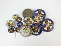 Lot 498 - A collection of enamel coins and brooches,...