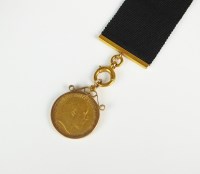 Lot 536 - An Edward VII half sovereign, within 9ct gold...