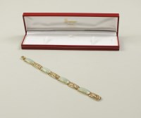 Lot 16 - A 9ct gold jade panel bracelet, designed as...