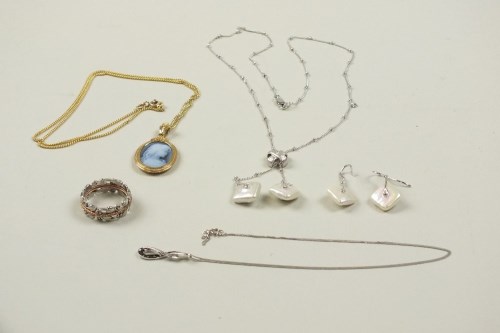 Lot 17 - A diamond and square baroque cultured pearl...