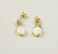 Lot 25 - A pair of opal ear pendants, each designed as...