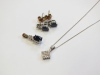Lot 30 - A diamond set square pendant, suspended from...