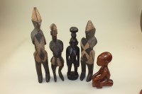 Lot 41 - A group of five carved wood African tribal...