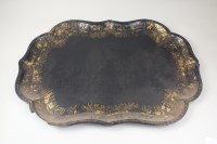 Lot 50 - A Victorian papier mache tray with shaped gilt...