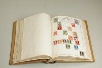 Lot 98 - A stamp album containing a collection of World...