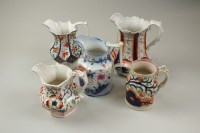 Lot 147 - A collection of 19th century Gaudy Welsh jugs,...