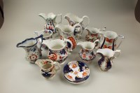 Lot 151 - A collection of 19th century Gaudy Welsh jugs,...