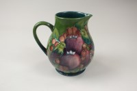 Lot 166 - A contemporary Moorcroft jug decorated Green...