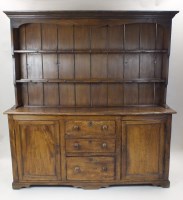 Lot 339 - A waxed pine dresser, the canopied top with...