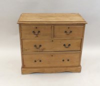 Lot 347 - A pine chest of two short and two long drawers...