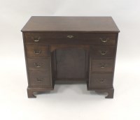 Lot 350 - A George III style mahogany kneehole desk with...