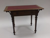 Lot 351 - An Edwardian oak desk the rectangular top with...