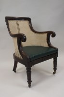 Lot 382 - A Regency mahogany desk chair with cane seat...