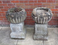 Lot 420 - A pair of circular stone reeded planters, 40cm...