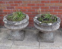 Lot 421 - A pair of composite stone urns in classical...