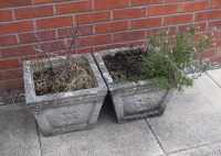 Lot 422 - A pair of canted stone planters, each moulded...