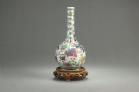Lot 107 - A Chinese blue and white famille rose bottle...