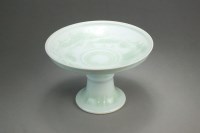 Lot 155 - A Chinese celadon glazed comport Yongzheng six-...