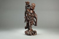 Lot 204 - A Chinese carved rootwood figure of a Buddha...