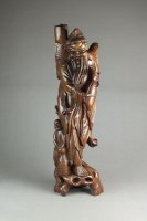 Lot 205 - A large Chinese carved rootwood figure of Fuxi...