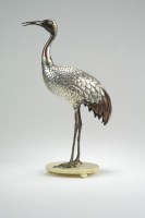 Lot 261 - A Japanese inlaid silver figure of a crane...