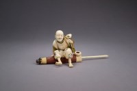 Lot 275 - A Japanese stained and inlaid ivory okimono of...