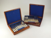 Lot 145 - A cased set of silver plated fruit knives and...