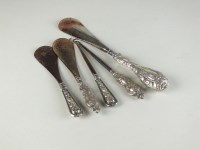 Lot 174 - Three silver mounted shoe horns, together with...