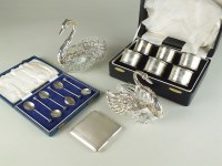 Lot 177 - A cased set of six silver napkin rings,...