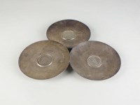 Lot 178 - Three silver bowls, each with coin inset,...