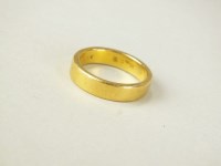 Lot 201 - A 22ct gold plain polished wedding band,...