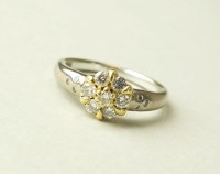 Lot 212 - An 18ct gold floral diamond cluster ring,...