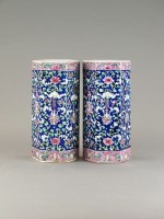 Lot 281 - A pair of Chinese famille rose sleeve vases...