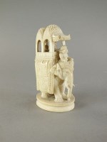 Lot 299 - An Indian carved ivory figure of a caparisoned...