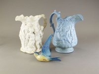 Lot 334 - Three Victorian relief moulded jugs, including...