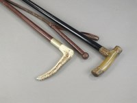 Lot 385 - A black malacca walking cane with gilt metal...