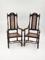 Lot 527 - A pair of William and Mary style oak cane back...