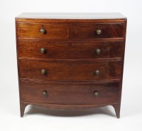 Lot 541 - A Regency mahogany bow front chest of two...