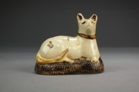 Lot 1 - A Whieldon-type creamware model of a cat...