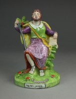 Lot 18 - A Staffordshire pearlware figure of St. Paul...