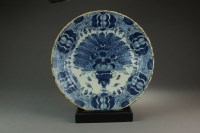 Lot 35 - A pair of Dutch delft blue and white peacock...