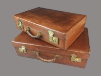 Lot 142 - Two leather suitcases, one stamped 'Guaranteed...